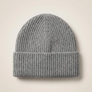 May include: A set of three ceramic mugs with a speckled, matte finish in cream, light brown, and dark brown. Each mug has a simple design and a rounded handle.