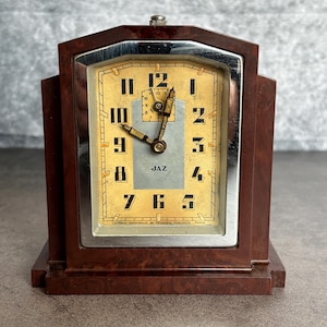 May include: A set of three ceramic mugs with a speckled, matte finish. The mugs are in shades of cream, light grey, and dark grey. Each mug has a simple, minimalist design, ideal for coffee or tea.