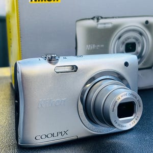 NIKON Coolpix 100 digital camera , Nikkor 5x zoom  , 20.1 megapixel , 40067555 , condition like new
