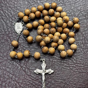 necklace with wooden beads, metal crucifix and medal of the Virgin Mary and Child, Germany mid 20th century