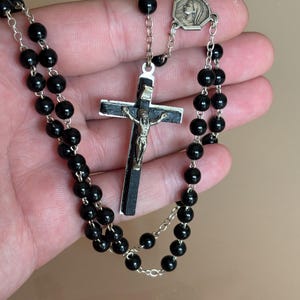 antique rosary black , metal wooden cross , virgin mary amulet , vintage beads and catholic crucifix