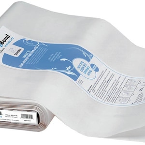 May include: A roll of white HeatnBond fusible web, a type of iron-on adhesive used for crafts and sewing projects. The label reads "HeatnBond Fusible Web Feather Lite 18 in x 25 yds (5.5 yds)".