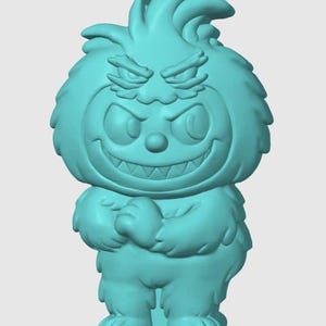 Könnte beinhalten: Türkisfarbene Figur eines Cartoon-Monsters mit verschmitztem Grinsen und gerunzelter Stirn. Das Monster hat einen pelzigen Körper, verschränkte Arme und große Füße. Seine Augen sind weit geöffnet und seine Zähne sind sichtbar.