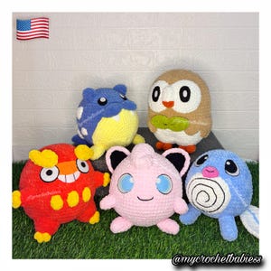 May include: Five round, plush, crocheted stuffed toys featuring various colorful designs. The collection includes a red creature with yellow spots, a blue and yellow figure, a brown and white owl-like character, a pink round toy, and a blue swirl-patterned creature.