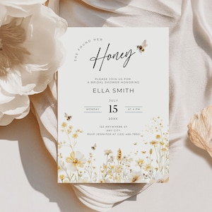 May include: A handmade wooden sign with the text "Welcome to our home" in a handwritten style. The sign is painted white with a distressed finish and a black border. A small, decorative heart is attached to the bottom.