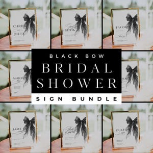 May include: A collection of eight white rectangular bridal shower signs displayed in gold frames, each featuring a black bow graphic and black text including Cards and Gifts, Guest Book, Favors, Mimosa Bar, Dessert, Love is Sweet, Photo Booth, and Custom Sign.