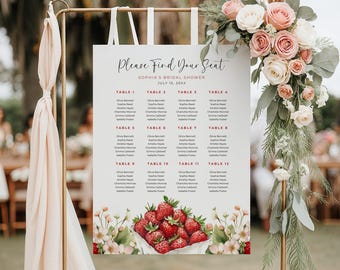 May include: A white seating chart with a red title "Please Find Your Seat" and the text "Sophia's Bridal Shower" and "July 15, 20XX". The chart lists tables 1 through 12 with guest names. The chart is decorated with a watercolour illustration of strawberries in a basket.