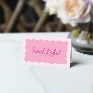 May include: Pink food label template with a scalloped border and the text "Food Label" in a pink cursive font. The text "Fully Editable" is in smaller, black font below the main text.