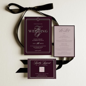 May include: A wedding invitation suite featuring a burgundy and white color scheme. The suite includes an invitation, details card, and RSVP card, all tied together with a black ribbon. The invitation text includes the names of the couple and the wedding date.
