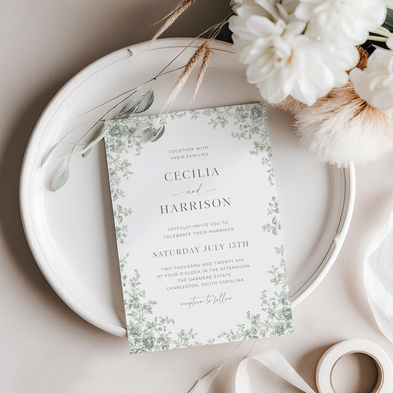 Editable green toile wedding invitation template featuring sage chinoiserie floral design, vintage French toile de Jouy pattern, and traditional elegant wedding card style