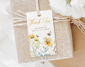 May include: A white thank you tag with gold lettering that says "Thank You so sweet of you to BEE here!" with a watercolor illustration of yellow flowers and bees.