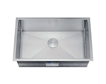 May include: A stainless steel kitchen sink with a single bowl and a drain in the center. The sink is rectangular and has a brushed finish.