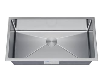 May include: A stainless steel kitchen sink with a single bowl and a drain in the center. The sink is designed with a slight slope towards the drain.