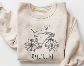Doxycycline Pharmacy Pun Sweatshirt, Dachshund Bicycle Gift