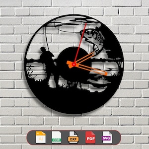 May include: Black and white silhouette of a person fishing with a fish jumping out of the water. The silhouette is on a black circle with a clock face in the center. The clock hands are red and orange. The image is on a white brick wall background. The image is for a digital download of a clock design in AI, CDR, DXF, PDF, and SVG formats.