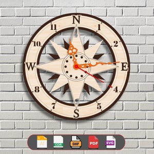 May include: A wooden compass clock with a brown frame and a light wood background. The clock face features Roman numerals and a compass rose with a starburst design. The clock hands are red and orange.