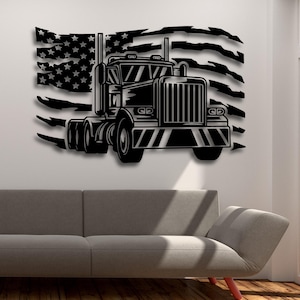May include: Black and white silhouette of a semi-truck with a large American flag behind it. The truck is facing forward and the flag is tattered and torn. The image is a wall decal.