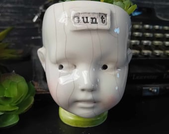 Ceramic doll head succulent planter C**T