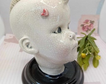 Dolls head sculpture Mohican mohawk