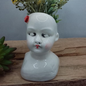 Doll head succulent planter