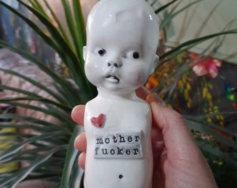 Baby torso ceramic doll