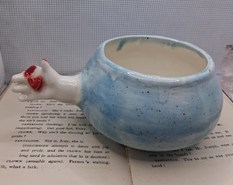 Handmade bowl with dolls arm amputated finger