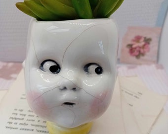 Ceramic doll head succulent planter