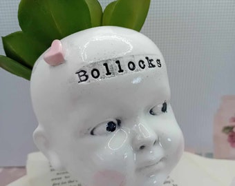 Ceramic doll head succulent planter Bollocks