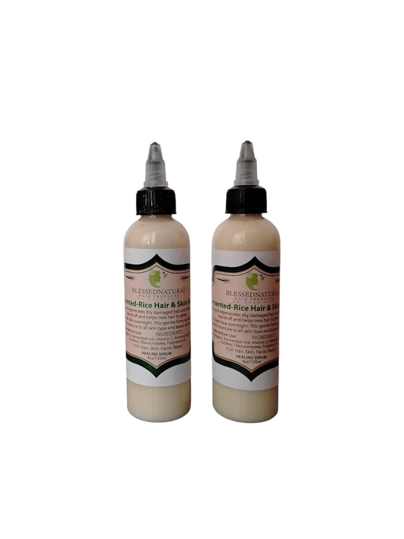 May include: Two clear glass bottles with black caps and labels. The labels are white with green accents and text that reads "Blessed Natural Hair Products Fermented-Rice Hair & Skin Serum". The bottles are filled with a light-colored liquid.