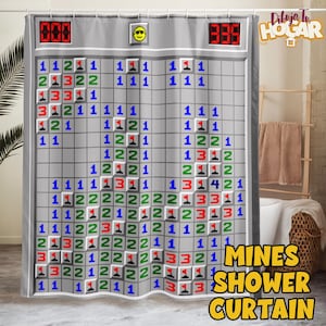 May include: Gray shower curtain featuring a Minesweeper game design. The curtain has a grid of numbered squares in various colors, with the words "MINES SHOWER CURTAIN" in yellow. The top has a smiley face and digital displays.