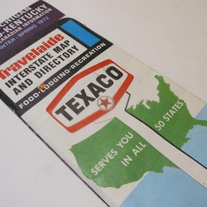 May include: Vintage Travelaide Interstate Map and Directory from 1972. The map features a Texaco logo and a green map of the United States. The map includes information for Michigan, Ohio, Kentucky, and Canadian information.