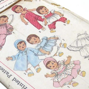 May include: Vintage sewing pattern for doll clothes. The pattern includes instructions for making a dress, a pair of pants, a shirt, and a coat. The pattern is printed on a white background with black and red text. The pattern is titled "Printed Pattern".