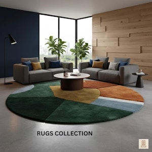 May include: A modern living room setup featuring a large, round area rug with a geometric design in shades of green, orange, and blue. Gray sofas with accent pillows surround a round coffee table. The text "RUGS COLLECTION" is displayed at the bottom.