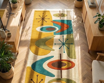 May include: A rectangular area rug featuring a cream-colored background with a repeating pattern of abstract shapes in mustard yellow, teal, olive green, and burnt orange. The design includes starburst motifs and curved boomerang-like forms.
