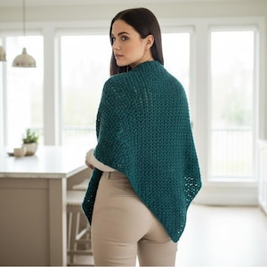 May include: A white ceramic mug with a black handle and the text "But First, Coffee" in a bold, black font. The mug is set against a neutral background, highlighting its simple design.