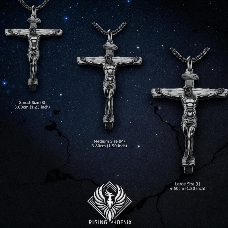 May include: Three silver-toned crucifix pendants of varying sizes are displayed against a dark blue background with stars. The sizes are labeled: Small (1.25 inches), Medium (1.50 inches), and Large (1.80 inches). The Rising Phoenix logo is at the bottom.