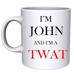 May include: White ceramic coffee mug with black text that reads "I'm John and I'm a TWAT" in red letters.