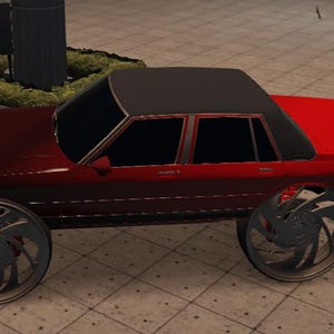 Puede incluir: Un sedán rojo y negro con grandes ruedas personalizadas negras. El coche tiene un techo negro y una carrocería roja.