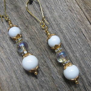 Dangle Earrings with White Beads, a Clear Bead with AB Coating and Gold Tone Findings