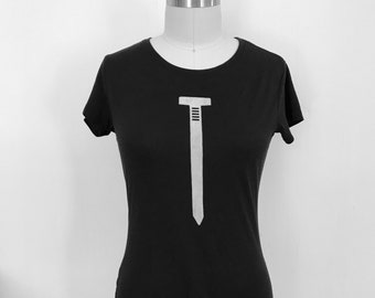 May include: Black t-shirt with a white nail graphic.