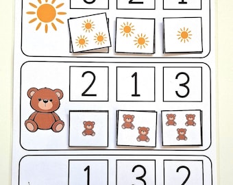 Könnte beinhalten: Ein weißes Lernblatt mit drei Reihen von Zählübungen. Jede Reihe zeigt eine Sonne, einen braunen Teddybären oder einen roten Marienkäfer, gefolgt von Kästchen mit den Zahlen 1, 2 und 3 sowie den entsprechenden Symbolgruppen.