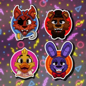 May include: Four colorful cartoon character stickers featuring Freddy Fazbear, Bonnie the Bunny, Chica the Chicken, and Foxy the Pirate Fox. Each character has a unique expression and is set against a contrasting background.