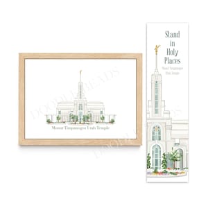 May include: A framed illustration of the Mount Timpanogos Utah Temple, a white building with a tall spire, surrounded by green trees and flowers. The frame is light brown wood. Below the image is the text "Mount Timpanogos Utah Temple". A bookmark with the same image and the text "Stand in Holy Places Mount Timpanogos Utah Temple" is also shown.
