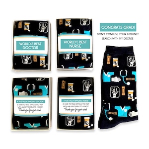 May include: Black socks with medical motifs like prescription bottles, X-ray images, and stethoscopes. Some are boxed, labelled "World's Best Doctor" and "World's Best Nurse". Other boxes say "A Toe-tally Amazing Doctor/Nurse". Text reads "Congrats Grad!"