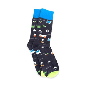 May include: A pair of black socks with a colorful design featuring computer icons, code, and other tech-related imagery. The socks have a blue cuff and a green and yellow trim.