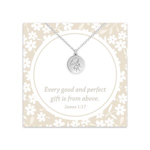May include: Silver necklace with a round pendant featuring a simple line drawing of a person praying. The card reads "Every good and perfect gift is from above. James 1:17"