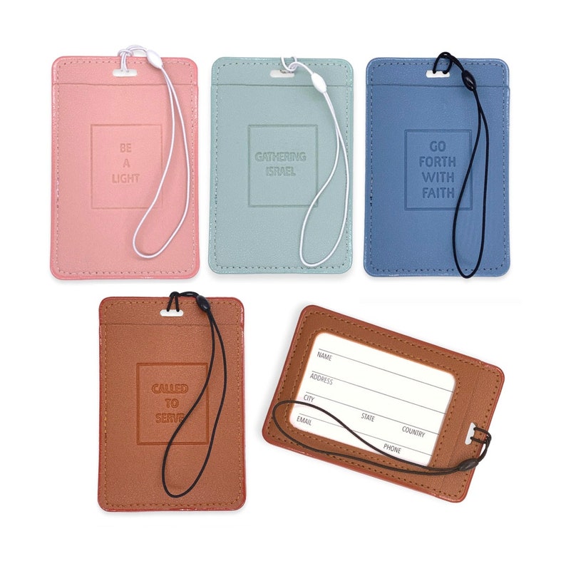 May include: Five different leather badge holders with a lanyard. The holders have different colors and sayings. The sayings are "Be a Light", "Gathering Israel", "Go Forth With Faith", "Called to Serve", and a blank holder with spaces for name, address, city, state, country, email, and phone.