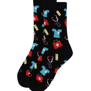 May include: A pair of black socks with a colorful pattern of medical symbols, including a stethoscope, first aid kit, and a doctor's uniform.