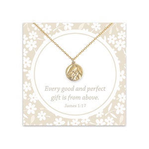 May include: Gold necklace with a round pendant featuring a textured image of two hands clasped together. The card reads "Every good and perfect gift is from above. James 1:17".
