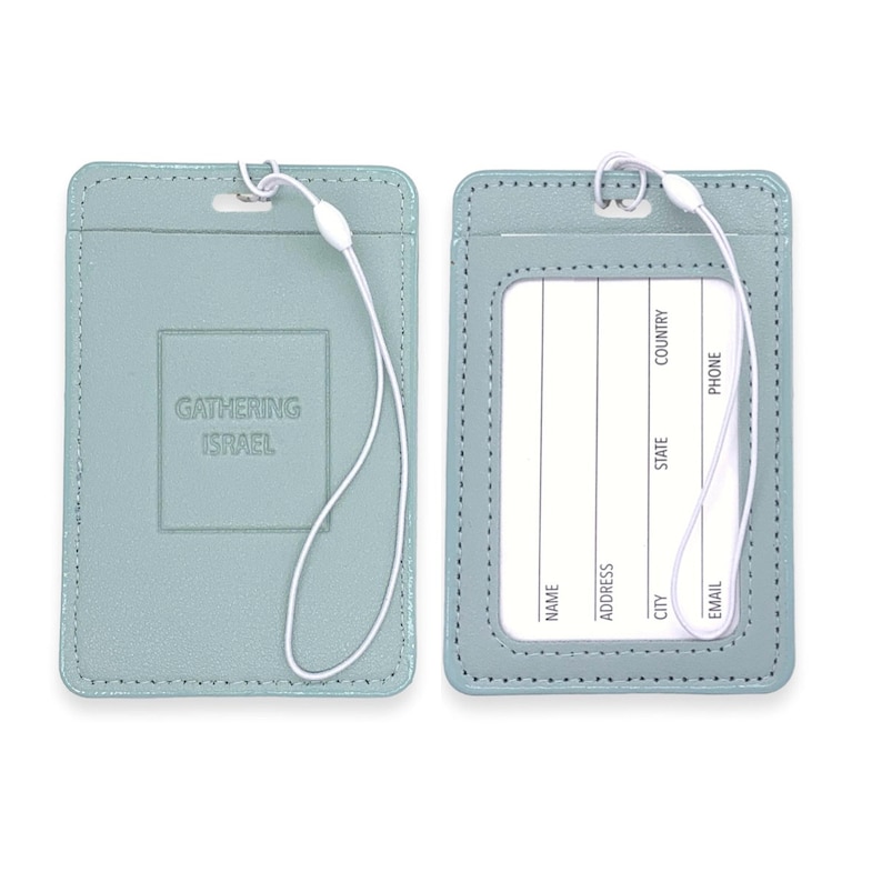 May include: Two light blue leather luggage tags with a white string attached. The tag on the left has the text "Gathering Israel" embossed on it. The tag on the right has a clear plastic window for inserting a name card and spaces for writing contact information.